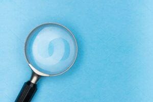 magnifying glass on a light blue background